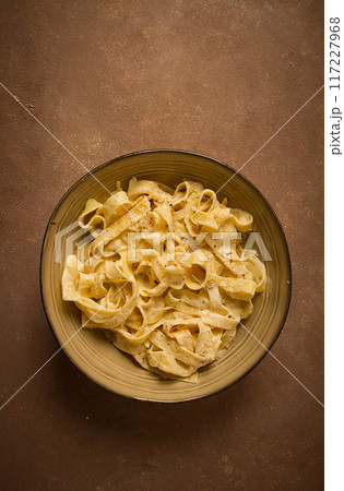 Fettuccine, tagliatelle, in creamy garlic sauce, Italian traditional cuisine, pasta carbonaro, Fettuccine, tagliatelle, in creamy garlic sauce, Italian traditional cuisine, pasta carbonaro, 117227968