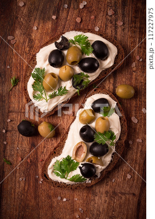 Breakfast, sandwiches, with cream cheese, olives, top view, 117227975