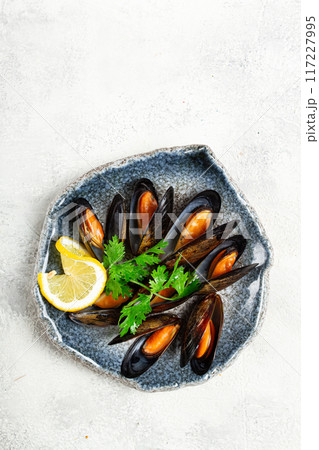mussels in shells, boiled in their own juice, in a bowl, gray background, top view, homemade , no people, 117227995