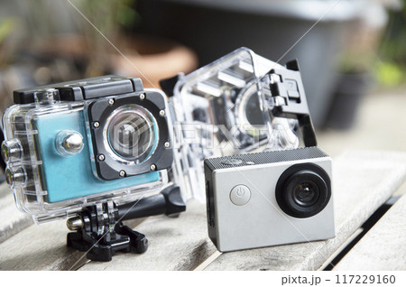 2 action cams placed on the floor, waterproof and dustproof 2 action cams placed on the floor, waterproof and dustproof 117229160
