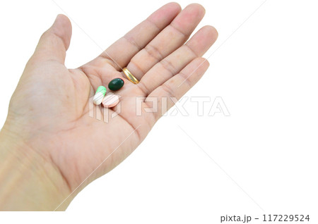 A hand with a pill on it, with clipping path A hand with a pill on it, with clipping path 117229524
