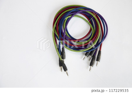 AUX audio cable on a white background AUX audio cable on a white background 117229535