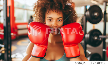 Energetic Mixed Race Woman in Boxing Arena: Empowerment Session 117230937