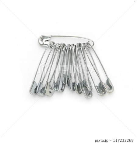 silver colored safety pins isolated on white background silver colored safety pins isolated on white background 117232269