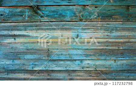 Panorama weathered wood old panel, aged, dilapidated cracked surface with grungy texture, flaking paint cyan hues. Decay, erosion decrepit plank or floorboard. Ancient board with chipped and peeling Panorama weathered wood old panel, aged, dilapidated cracked surface with grungy texture, flaking paint cyan hues. Decay, erosion decrepit plank or floorboard. Ancient board with chipped and peeling 117232798