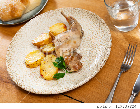 Appetizing stew with rabbit and potatoes. Healthy hearty dinner 117235824