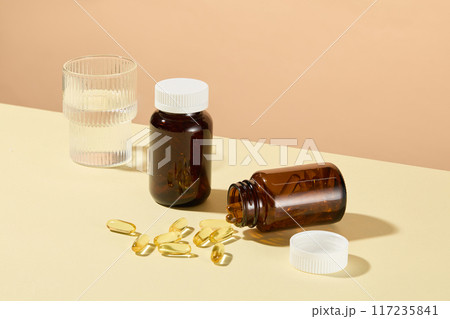 The promotional photo for nutritional supplements products, which used to improve the diet, contain vitamins, minerals, herbs or amino acids. High angle shot, mock up bottles for branding 117235841