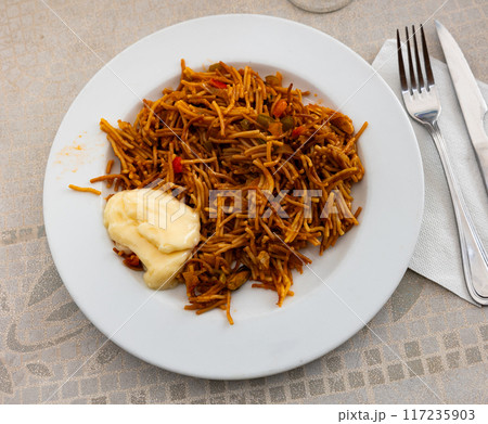 Fideua with seafood served on platter Fideua with seafood served on platter 117235903