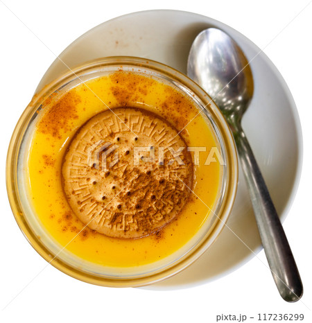 Delicate custard dessert made from milk, eggs and sugar, ornamented with soda biscuit. Delicate custard dessert made from milk, eggs and sugar, ornamented with soda biscuit. 117236299
