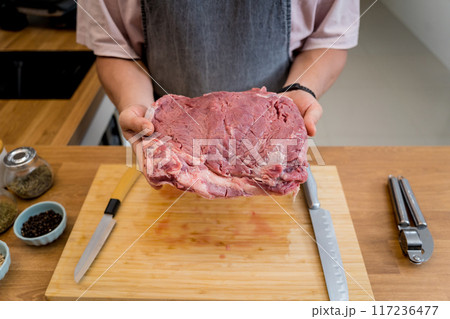 Raw fillet beef meat for steaks on the home electric grill Raw fillet beef meat for steaks on the home electric grill 117236477