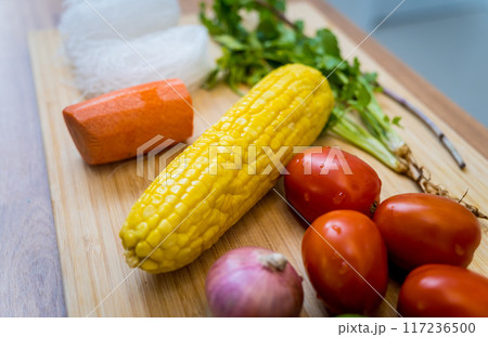Cutting board with ingredients for preparing spicy glass noodle salad 117236500