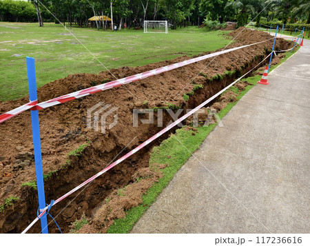 There is a significant heap of soil beside the road There is a significant heap of soil beside the road 117236616
