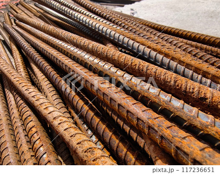 A rusty metal bars is stacked at the construction site A rusty metal bars is stacked at the construction site 117236651