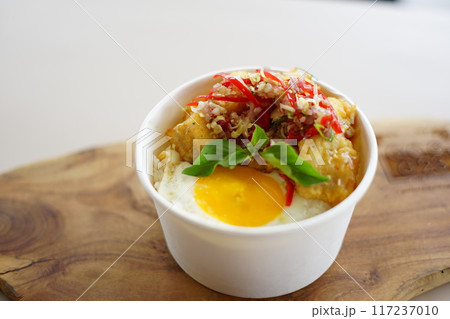 A bowl of food with meat and eggs A bowl of food with meat and eggs 117237010