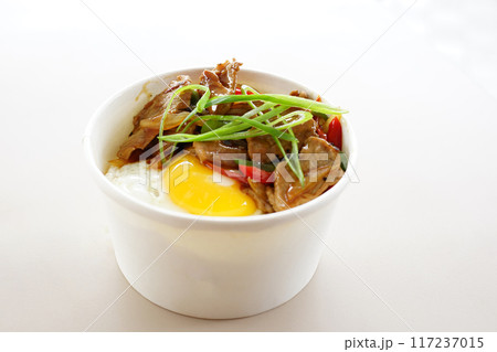 A bowl of food with meat and eggs A bowl of food with meat and eggs 117237015