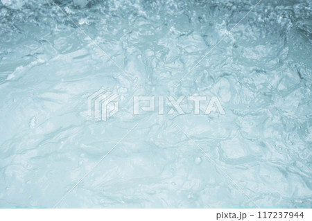 Turbulent water surface with visible foam and ripples. Turbulent water surface with visible foam and ripples. 117237944