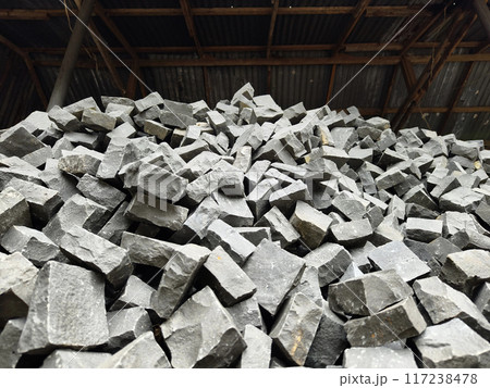 Stacked rocks showcasing natural material in construction Stacked rocks showcasing natural material in construction 117238478