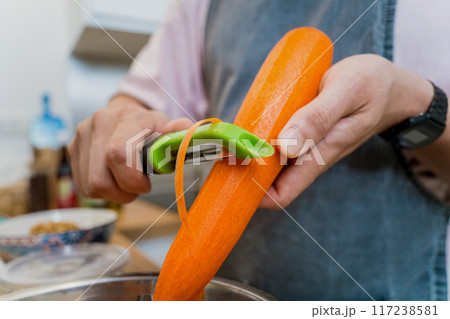 Chef at the kitchen preparing massaman curry with sweet potato and many spices Chef at the kitchen preparing massaman curry with sweet potato and many spices 117238581