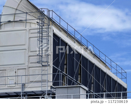 Ventilation pipes on the top of large industrial building 117238619