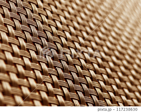 A closeup view of a wicker mat placed on a wooden table A closeup view of a wicker mat placed on a wooden table 117238630
