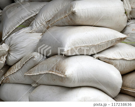 Stacking of big white bags in the modern warehouse Stacking of big white bags in the modern warehouse 117238636