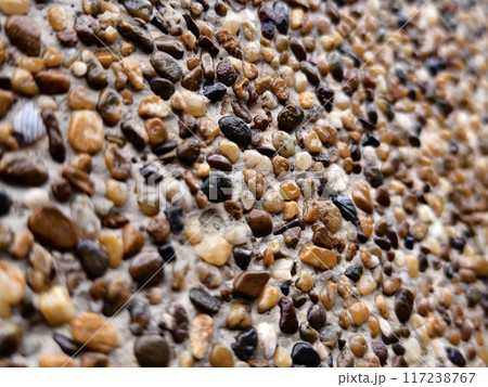 A pile of concrete tiles filled with rocks on top A pile of concrete tiles filled with rocks on top 117238767