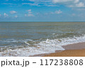 Soft wave beach with golden sand under blue sky  117238808