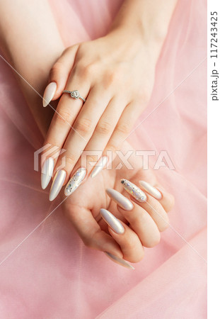 Female Hands with beautiful pearl manicure 117243425