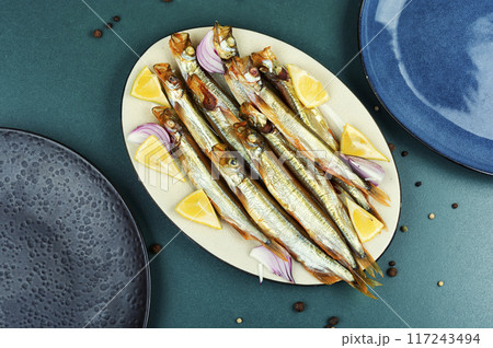 Smoked capelin fish with lemon Smoked capelin fish with lemon 117243494