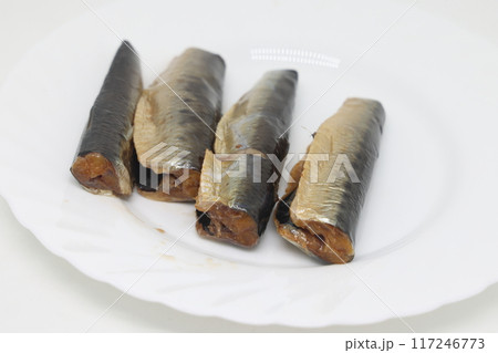 Small cold smoked wasashi fish, close up, isolated on white background. 117246773