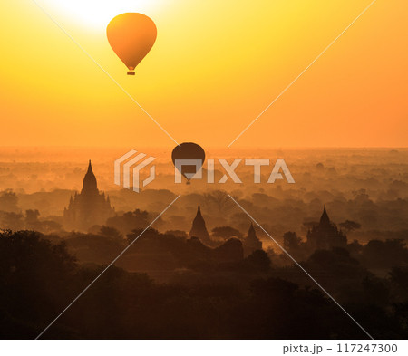 Balloon over plain of Bagan in misty morning, Myanmar Balloon over plain of Bagan in misty morning, Myanmar 117247300