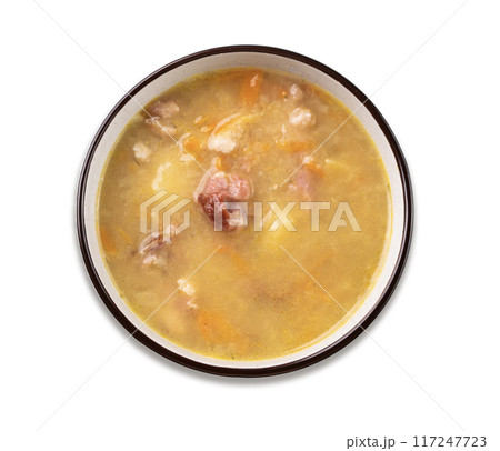 Pea soup with smoked ham in black bowl on white isolated. Healthy homemade  food. 117247723
