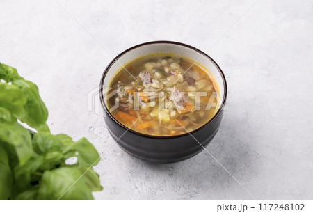 Traditional Russian soup with pickled cucumbers. Pickle with pearl barley and meat Traditional Russian soup with pickled cucumbers. Pickle with pearl barley and meat 117248102