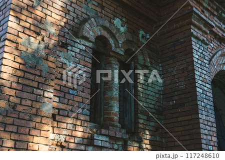 The old window of the stable is made of red brick. 19th century buildings. 117248610