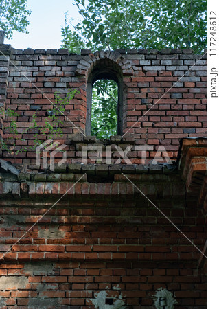 The old window of the stable is made of red brick. 19th century buildings 117248612