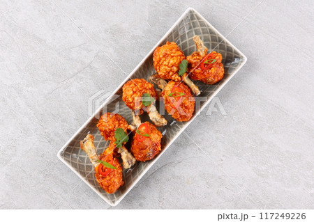 deep fried chicken wings with sweet and sour sauce 117249226