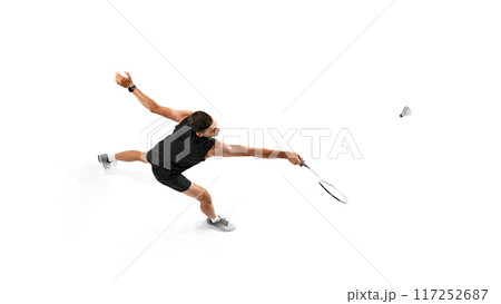 Focused and motivated man, badminton player training, playing with intensity and determination isolated on white background 117252687