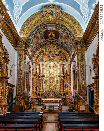 The golden interior of the Carmelite church Igreja do Carmo at Faro in Portugal 117253921