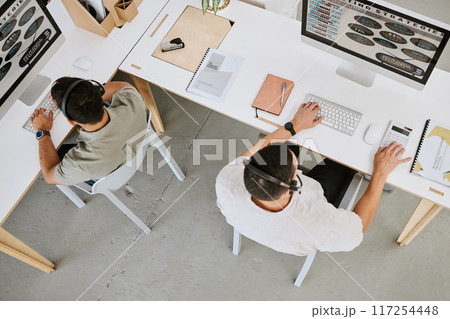 Call center agents, customer support and insurance consulting service employees helping clients top view. Colleagues wearing headsets talking to clients about us a company about our quality services Call center agents, customer support and insurance consulting service employees helping clients top view. Colleagues wearing headsets talking to clients about us a company about our quality services 117254448
