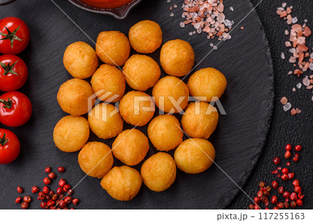 Cheese or potato balls breaded with salt, spices and herbs Cheese or potato balls breaded with salt, spices and herbs 117255163