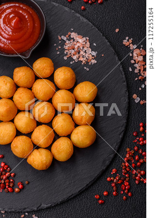 Cheese or potato balls breaded with salt, spices and herbs Cheese or potato balls breaded with salt, spices and herbs 117255164