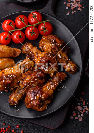 Delicious crispy baked chicken wings in teriyaki sauce Delicious crispy baked chicken wings in teriyaki sauce 117255200