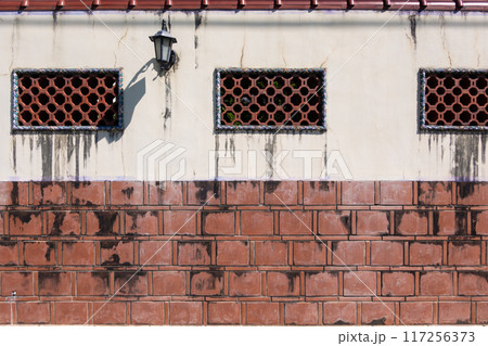 Chinese red brick walls with lattice windows 117256373