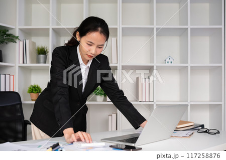 Young Asian businesswoman in the office is disappointed and stressed about her performance in the company. Young Asian businesswoman in the office is disappointed and stressed about her performance in the company. 117258876