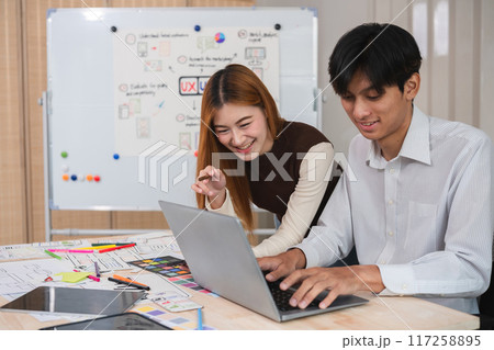 A team of designers helps develop the application system. Brainstorm ideas for making ux ui to develop programs 117258895