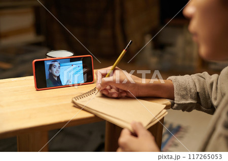 Attending Online Lecture with Notes and Tablet 117265053