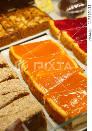 An array of baked goods, including pastries, is showcased in the bakery 117265151
