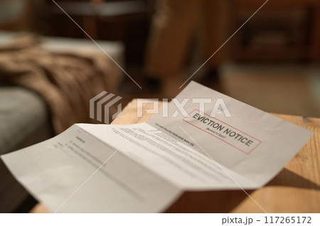 Room Eviction Notice Placed On Wooden Desk Room Eviction Notice Placed On Wooden Desk 117265172
