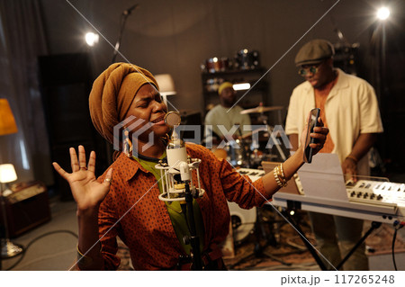 Singing with Passion in Recording Studio Using Microphone Singing with Passion in Recording Studio Using Microphone 117265248