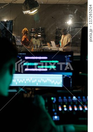 Recording Studio Session Capturing Musicians Performing 117265264